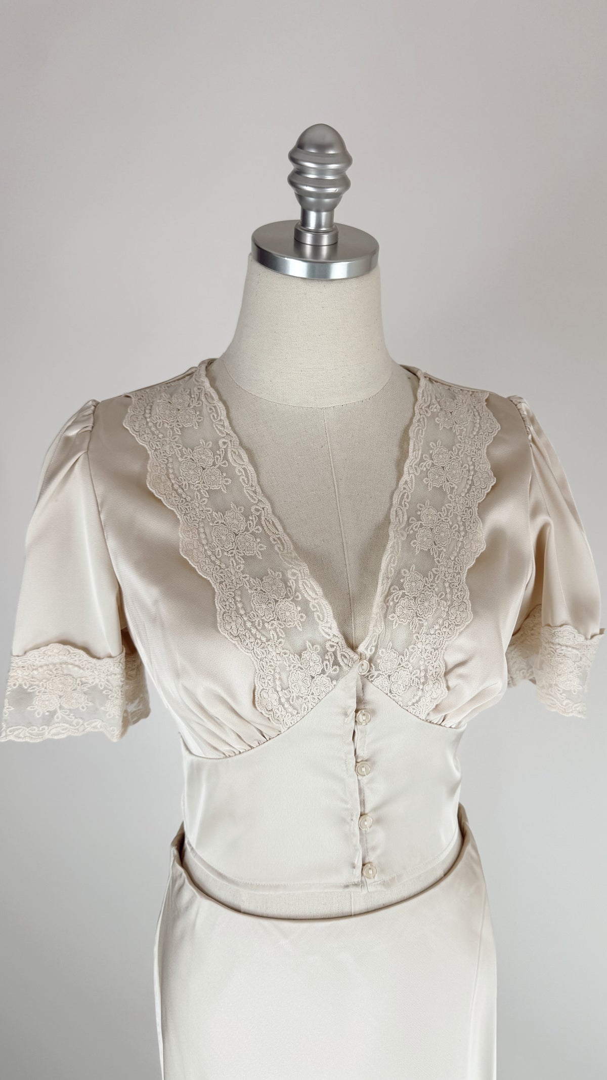Mildred Ivory Satin Button Top